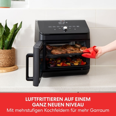 Schwarzer Airfryer mit Essen, roter Handschuh, Text: Luftfrittieren auf einem ganz neuen Niveau